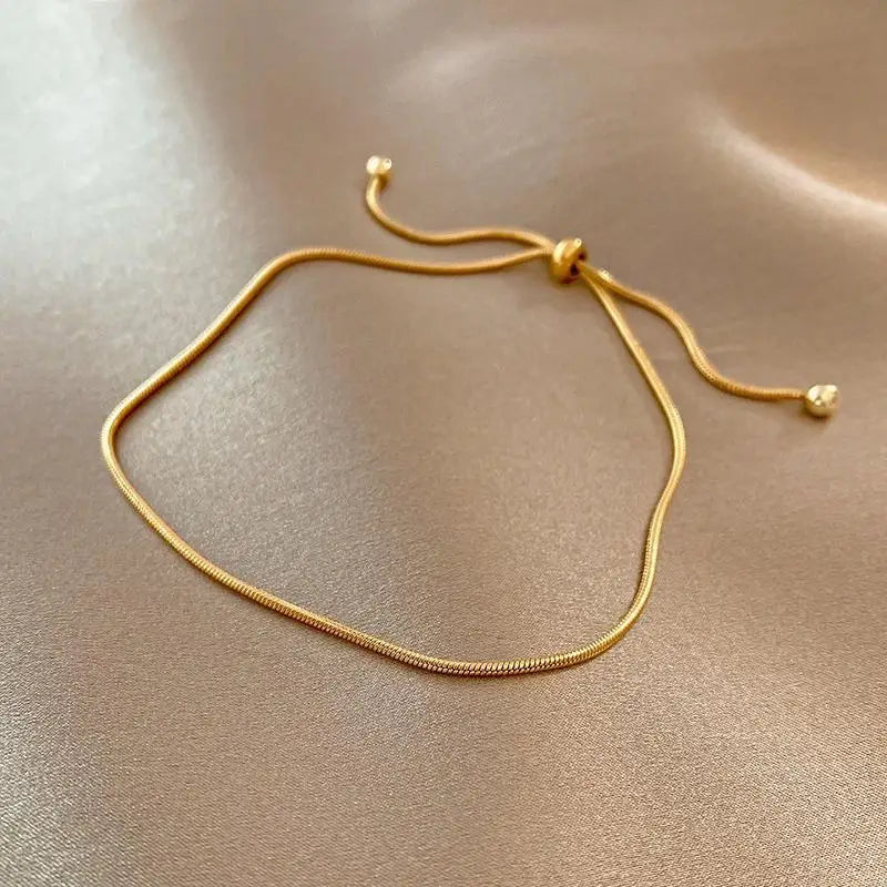 Pulseira laço banhada a ouro 18k